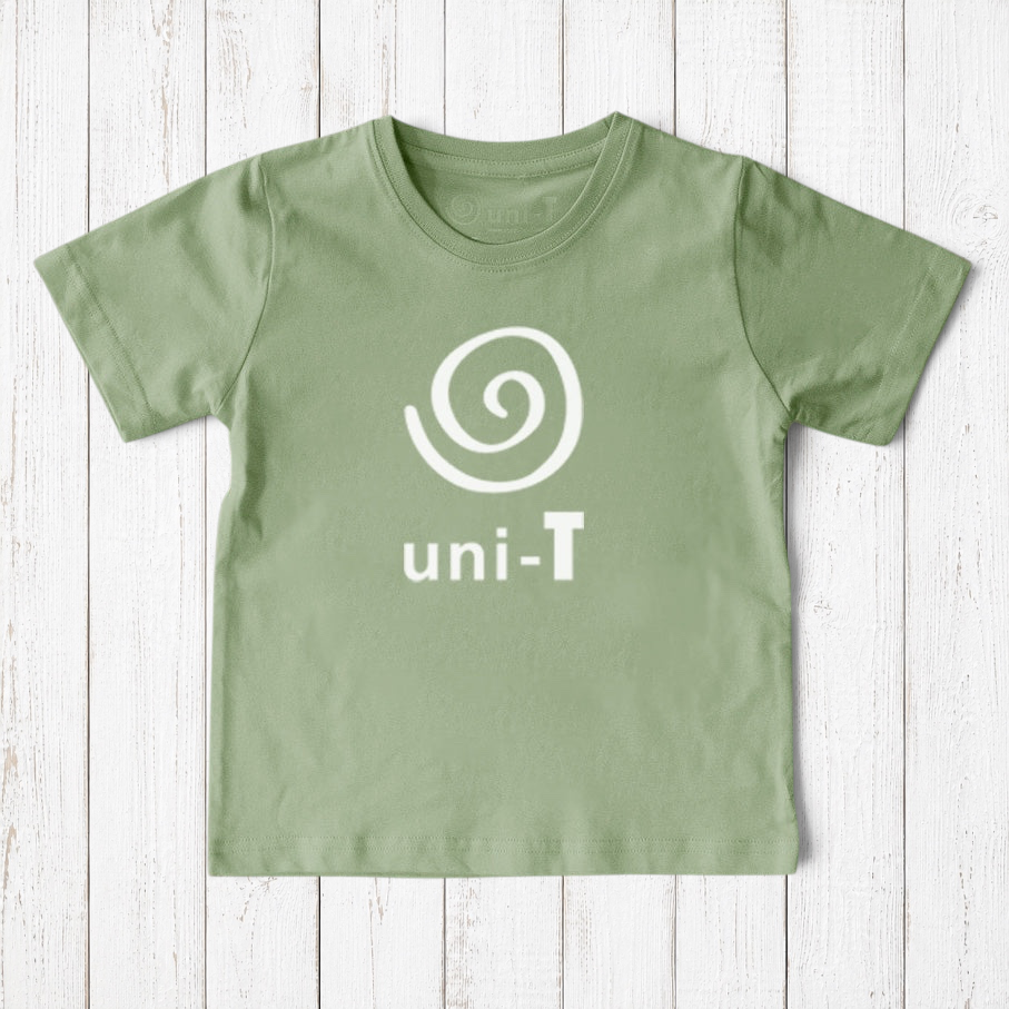 Uni-T kids organic cotton t-shirt in sage green with a white spiral unity graphic logo on a rustic wood background
