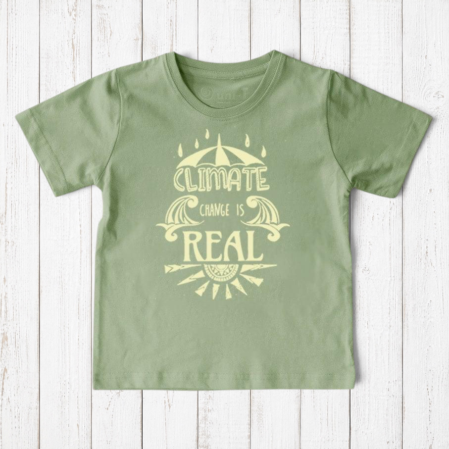 Uni-T sage green organic cotton kids t-shirt featuring a Climate Change Is Real graphic print on a wooden background.