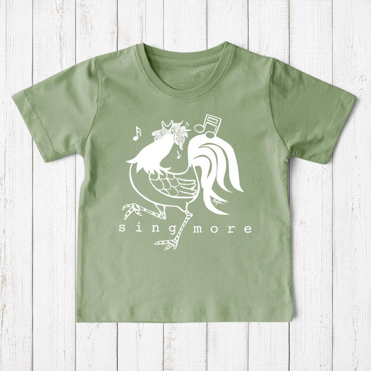 Uni-T sage green organic cotton kids t-shirt featuring a white hand-illustrated rooster graphic and Sing More text.