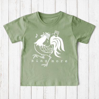 Uni-T sage green organic cotton kids t-shirt featuring a white hand-illustrated rooster graphic and Sing More text.