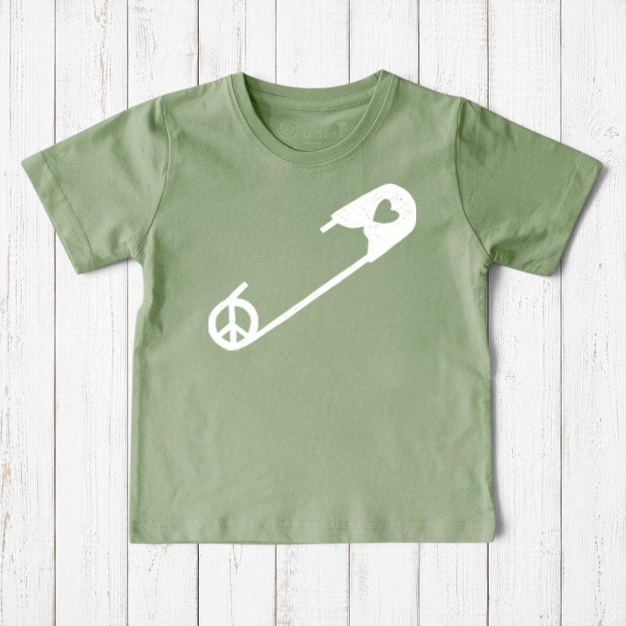 Uni-T sage green organic cotton kids t-shirt featuring a white safety pin graphic with a peace sign symbol