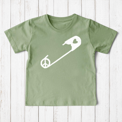 Uni-T sage green organic cotton kids t-shirt featuring a white safety pin graphic with a peace sign symbol