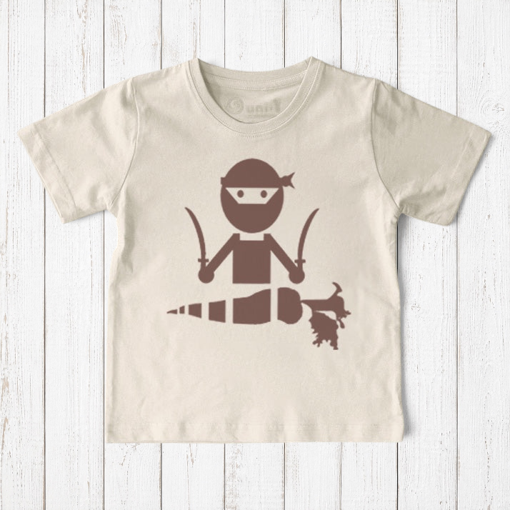 Uni-T kids organic cotton t-shirt in cream featuring a brown hand-illustrated ninja chopping a carrot with swords