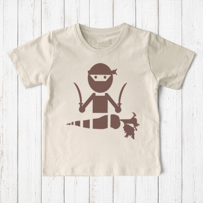 Uni-T kids organic cotton t-shirt in cream featuring a brown hand-illustrated ninja chopping a carrot with swords