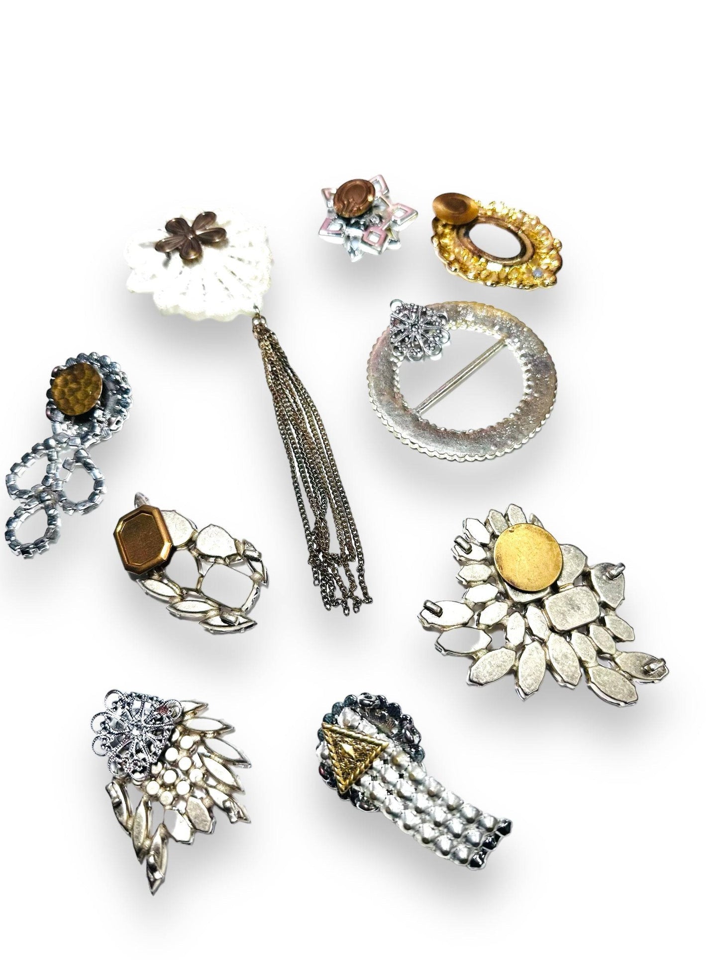Rear view of Uni-T magnet brooches showing magnet placements, designed for secure, pin-free wear on clothing or as fridge decor.