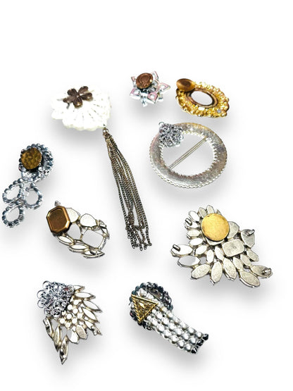 Rear view of Uni-T magnet brooches showing magnet placements, designed for secure, pin-free wear on clothing or as fridge decor.