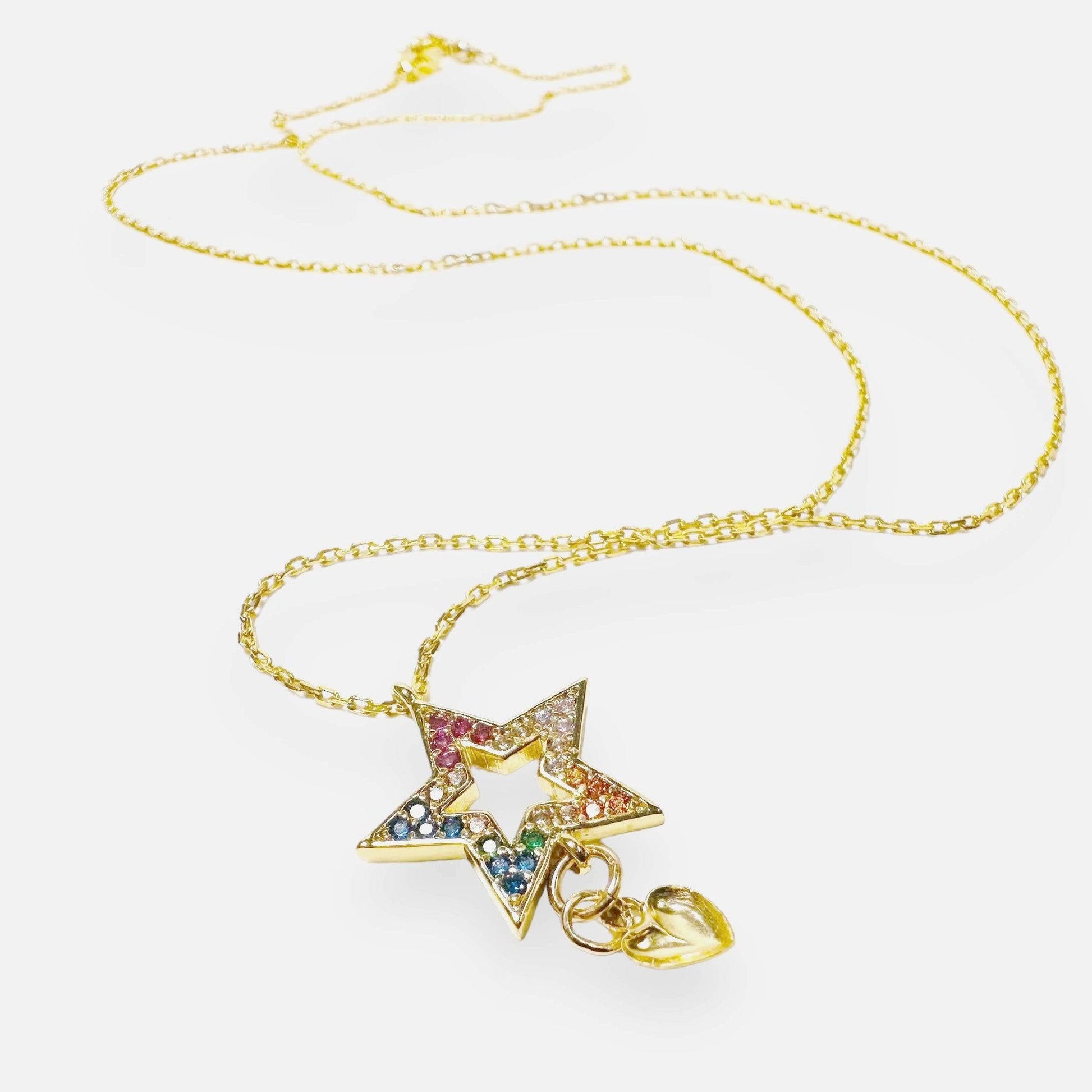 Cubic Zirconia Star Necklace with multicolor stones on an 18in gold chain, featuring a dangling heart charm for a playful, layered look.
