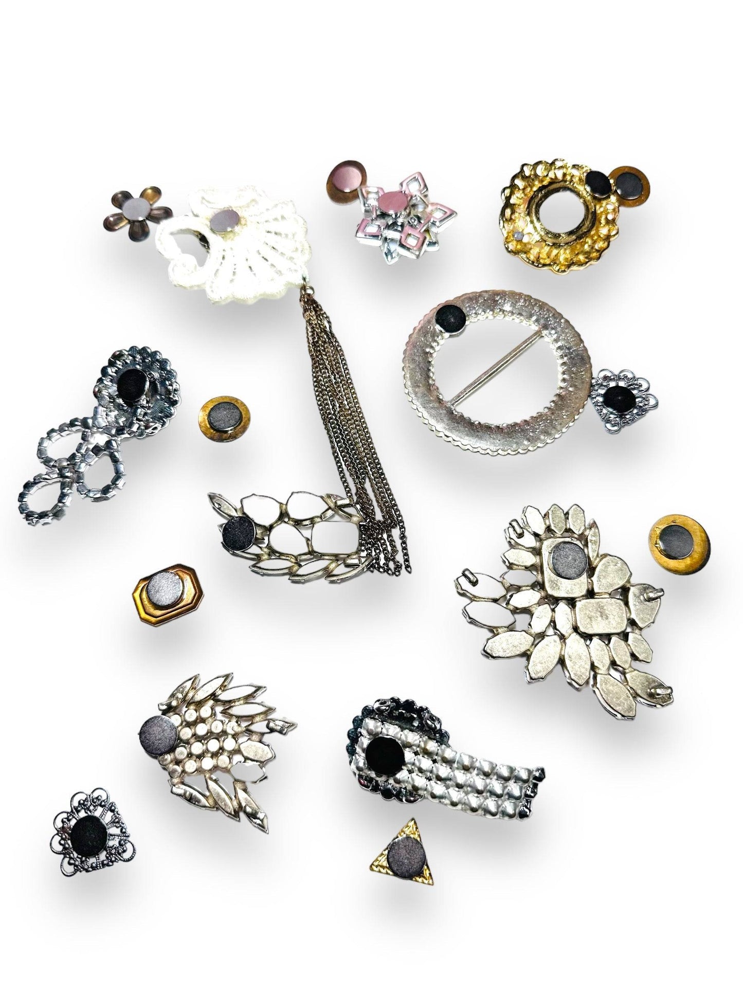 Back view of Uni-T Magnet Brooches showing strong magnet attachments for secure, pin-free wear on clothing or as decorative fridge magnets.