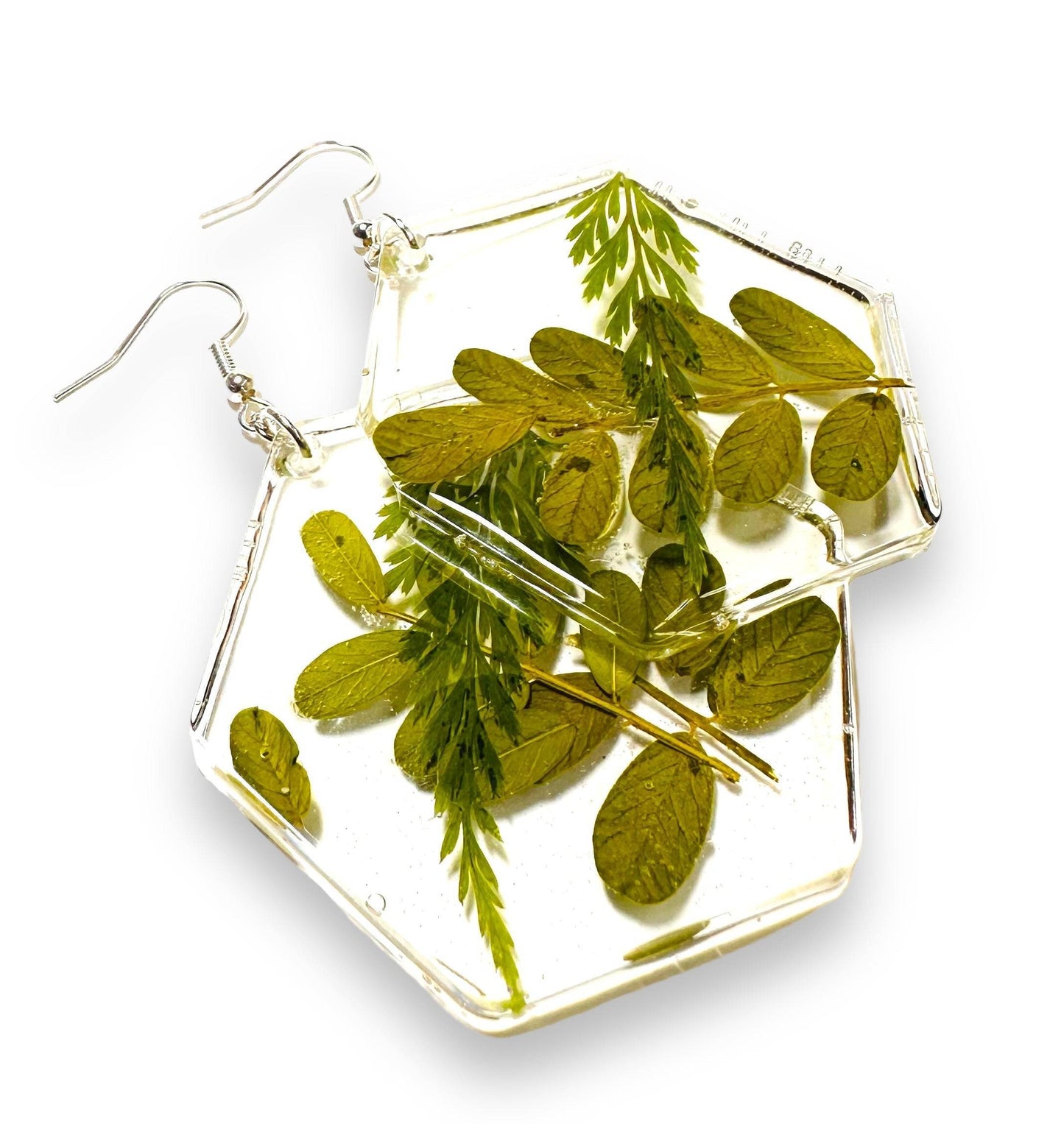 Hexagon resin earrings with green leaves and silver hooks. Botanical style from the Pressed Flower Earrings - Real Flowers line.
