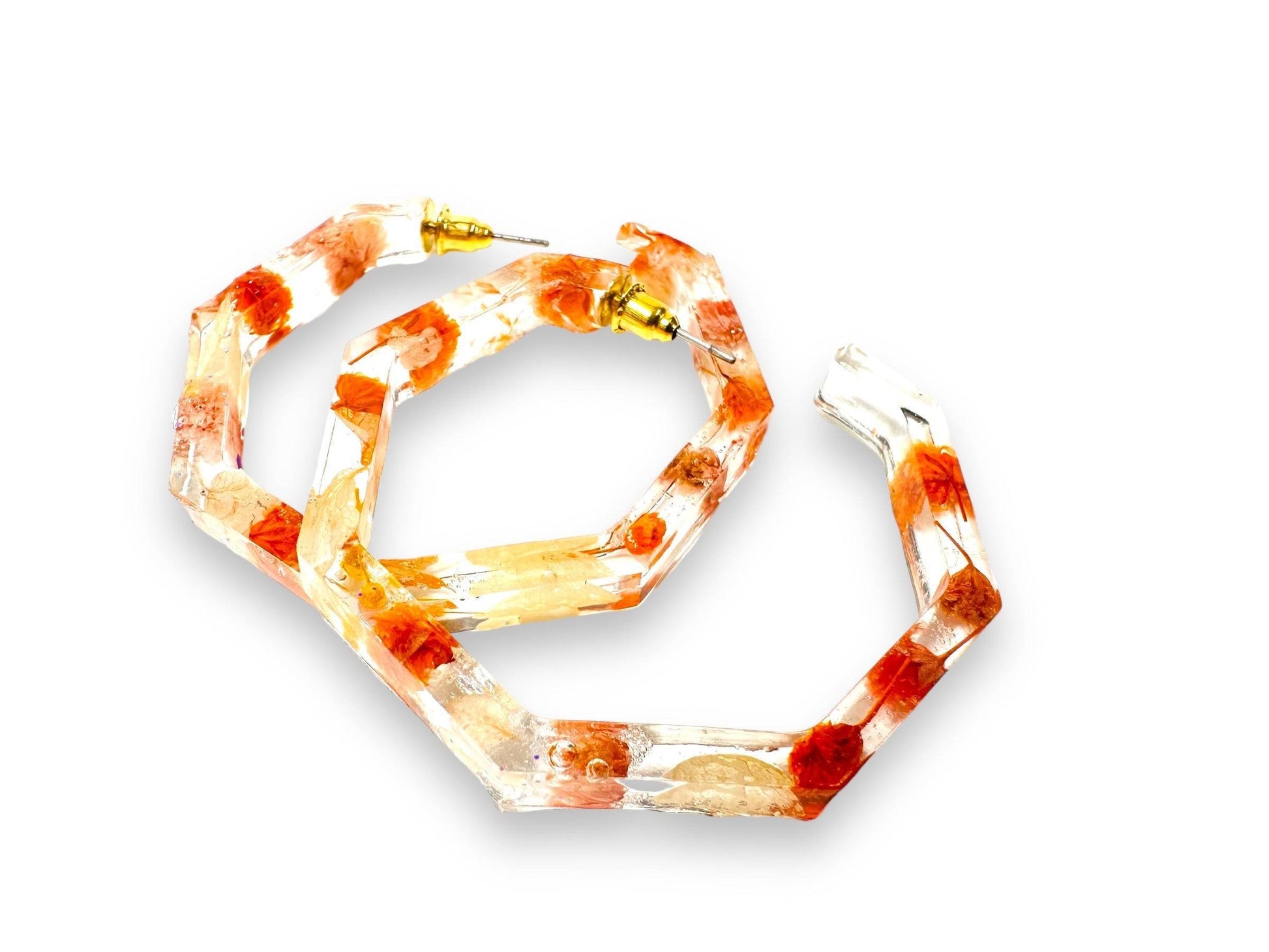 Hexagon hoop earrings with orange and white real flowers in resin. Unique geometric style from Pressed Flower Earrings collection.