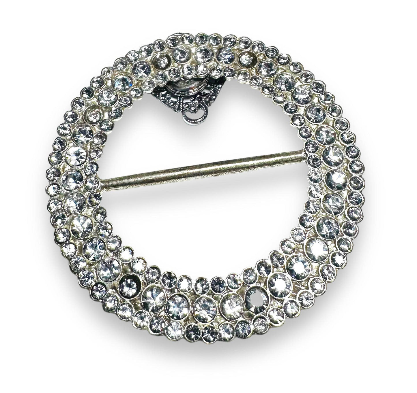 Round rhinestone Uni-T magnet brooch with layered crystal design, offering strong magnetic hold for secure, stylish wear.