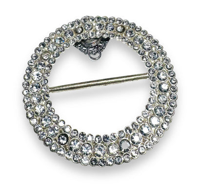 Round rhinestone Uni-T magnet brooch with layered crystal design, offering strong magnetic hold for secure, stylish wear.