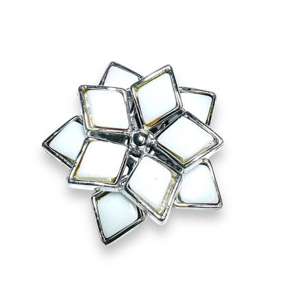 White enamel flower-shaped Uni-T magnet brooch with silver trim, a chic and modern accessory for scarves or lapels.