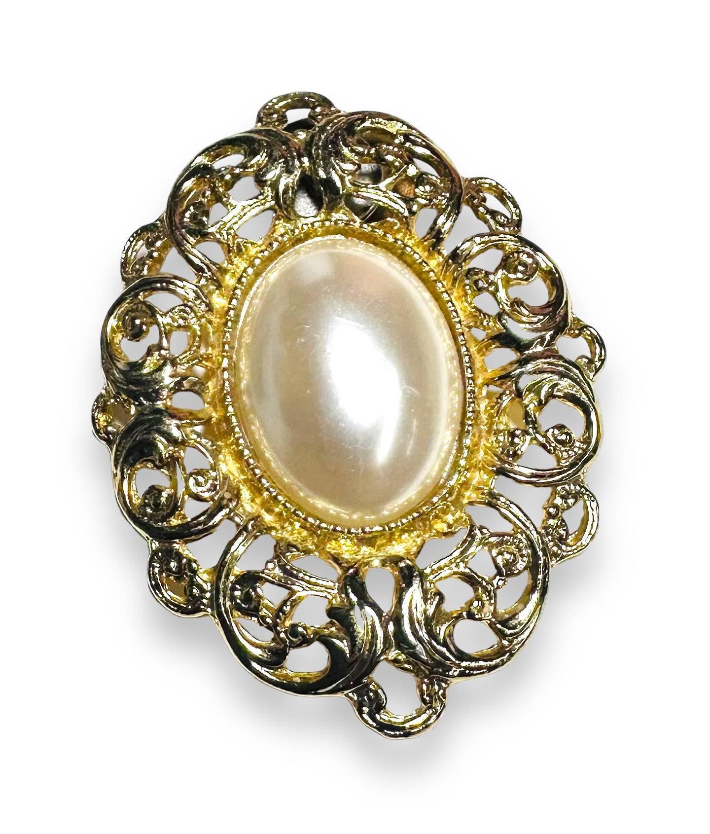 Gold-tone vintage Uni-T magnet brooch with pearl center and ornate filigree, perfect for elegant outfits or as a handcrafted gift.