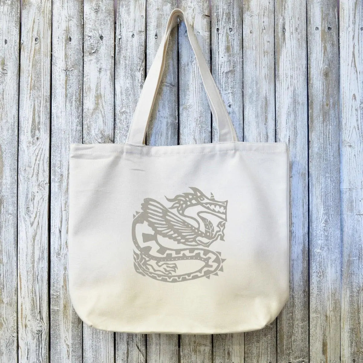Dragon canvas tote bag made from organic cotton featuring an ancient dragon artist design, ideal fantasy gift for eco-conscious shoppers.
