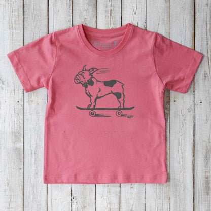 Coral pink kids’ t-shirt made from organic cotton, featuring a black skateboarding French Bulldog. Eco-friendly Uni-T graphic tee.