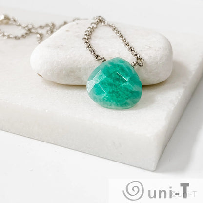 Buy Amazonite Gemstone Necklaces Online - Uni-T featuring a teardrop-shaped amazonite pendant on a sterling silver chain, displayed on white stone.