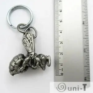 Anatomical Honey Bee Keychain next to ruler for size reference, featuring detailed internal and external anatomy in a compact design.