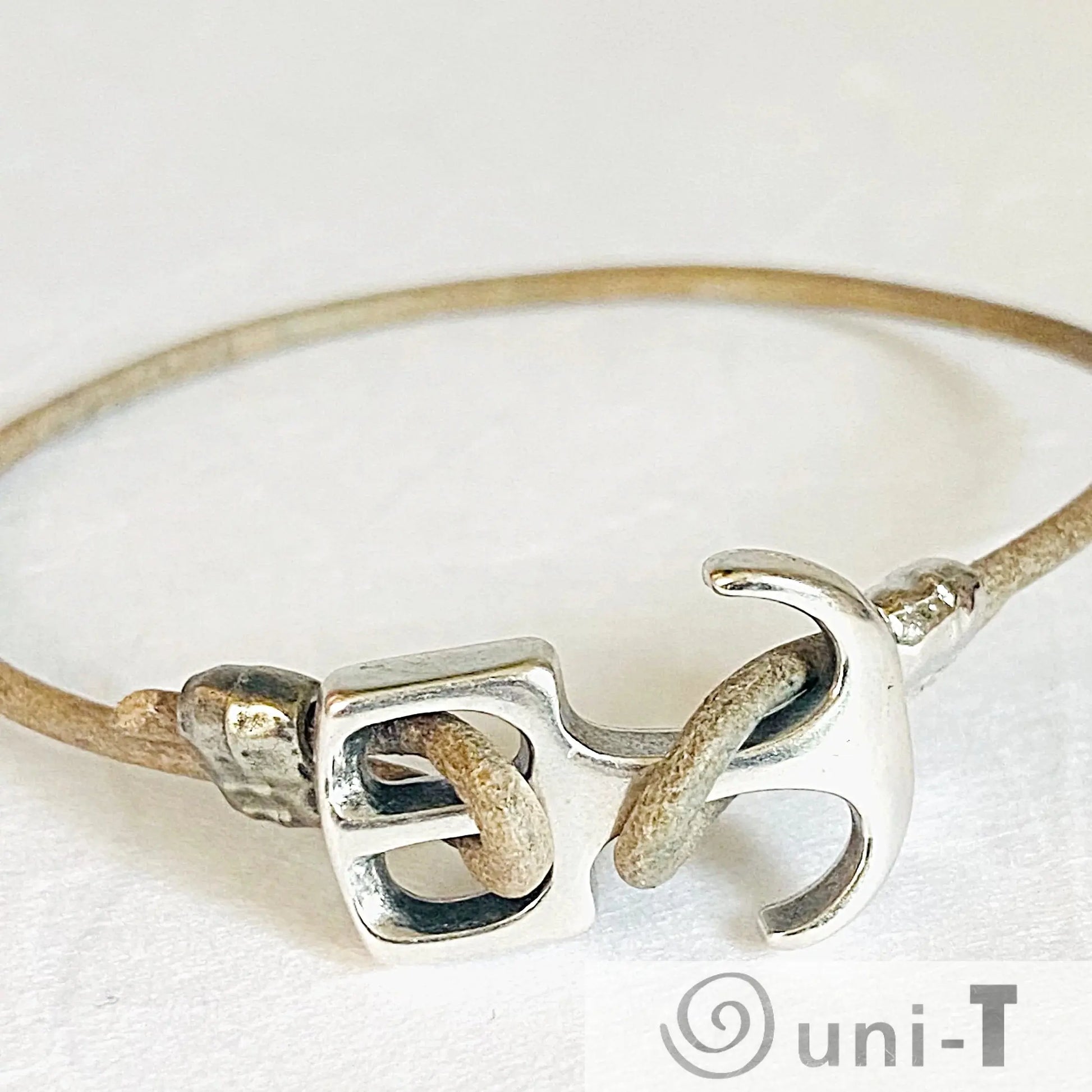 Anchor Bracelet Nautical Jewelry with brass anchor clasp and tan leather cord. Stylish nautical accessory perfect for ocean lovers and gifting.