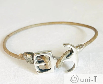 Brass Anchor and Leather Bracelet featuring nautical theme and minimalist design. Ideal for casual wear or as a unique nautical jewelry gift.
