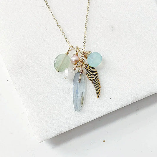 Gemstone Charm Necklace - Gold Filled Jewelry featuring kyanite, freshwater pearl, and gold plated angel wing on a delicate 18” chain.