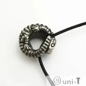 Top view of Armadillo Lizard Necklace pendant showing curled lizard design. Unique jewelry with desert-inspired reptile motif.