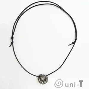 Full view of Armadillo Lizard Necklace with adjustable black cord. Distinctive coiled reptile pendant for unique jewelry collections.