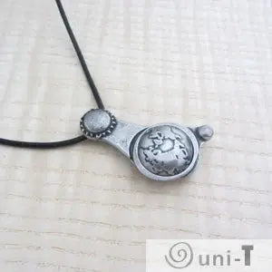 Articulating Tides Necklace with celestial Earth, Sun, and Moon design on black cord. Ideal jewelry for ocean lovers and astronomy enthusiasts.