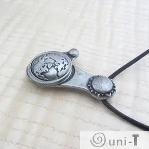 Side angle of Articulating Tides Necklace highlighting 3D Earth detail. A symbolic piece for those fascinated by tidal forces and celestial motion.