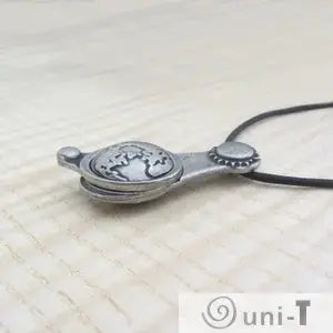 Close-up of Articulating Tides Necklace showing layered Earth and Moon design. Perfect for nature-inspired and astronomy-themed accessories.