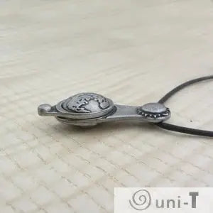 Angled view of Articulating Tides Necklace featuring Earth, Sun, and Moon. A meaningful necklace for ocean and science lovers.