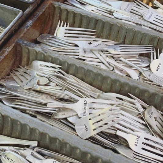 Swiss Cheese Marker Set with engraved vintage forks labeled for cheese types, ideal for rustic cheese displays and practical kitchen use.