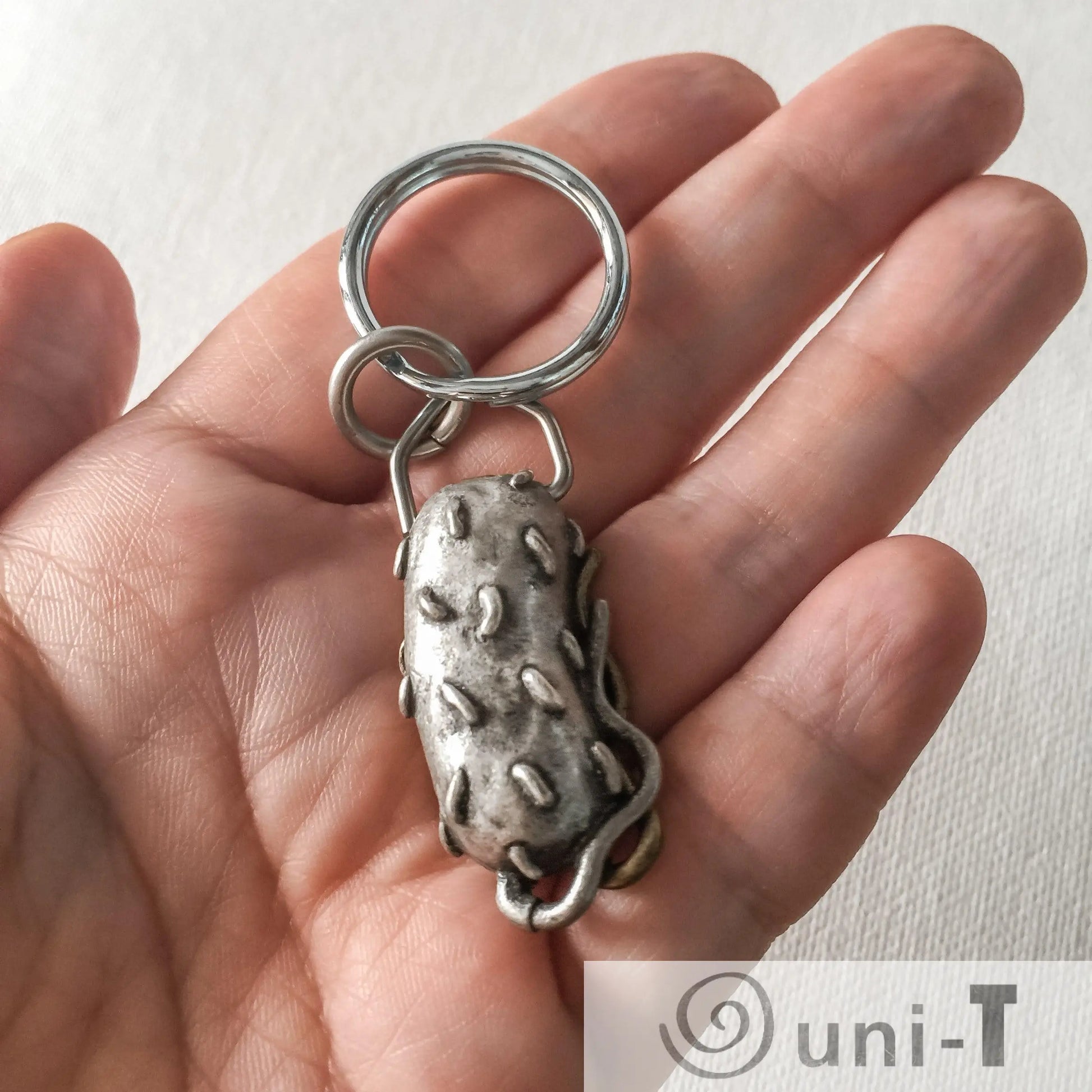 Bacterium Keychain - Bacteria Gift | Educational, Unique science-themed keychain held in hand, showcasing compact size and detailed design.