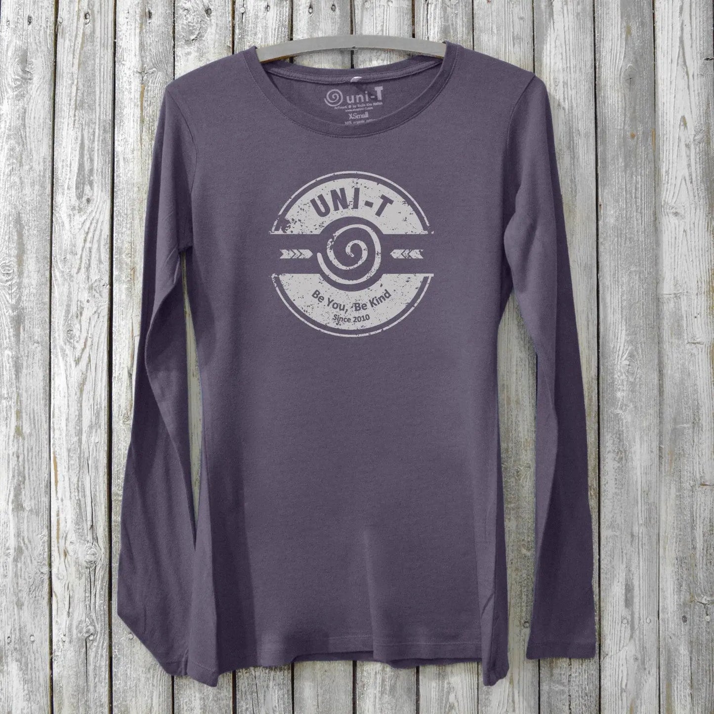 Purple eco-friendly women's long sleeve tee with 'Be You, Be Kind' design. Made from bamboo and organic cotton by Uni-T for mindful fashion lovers.