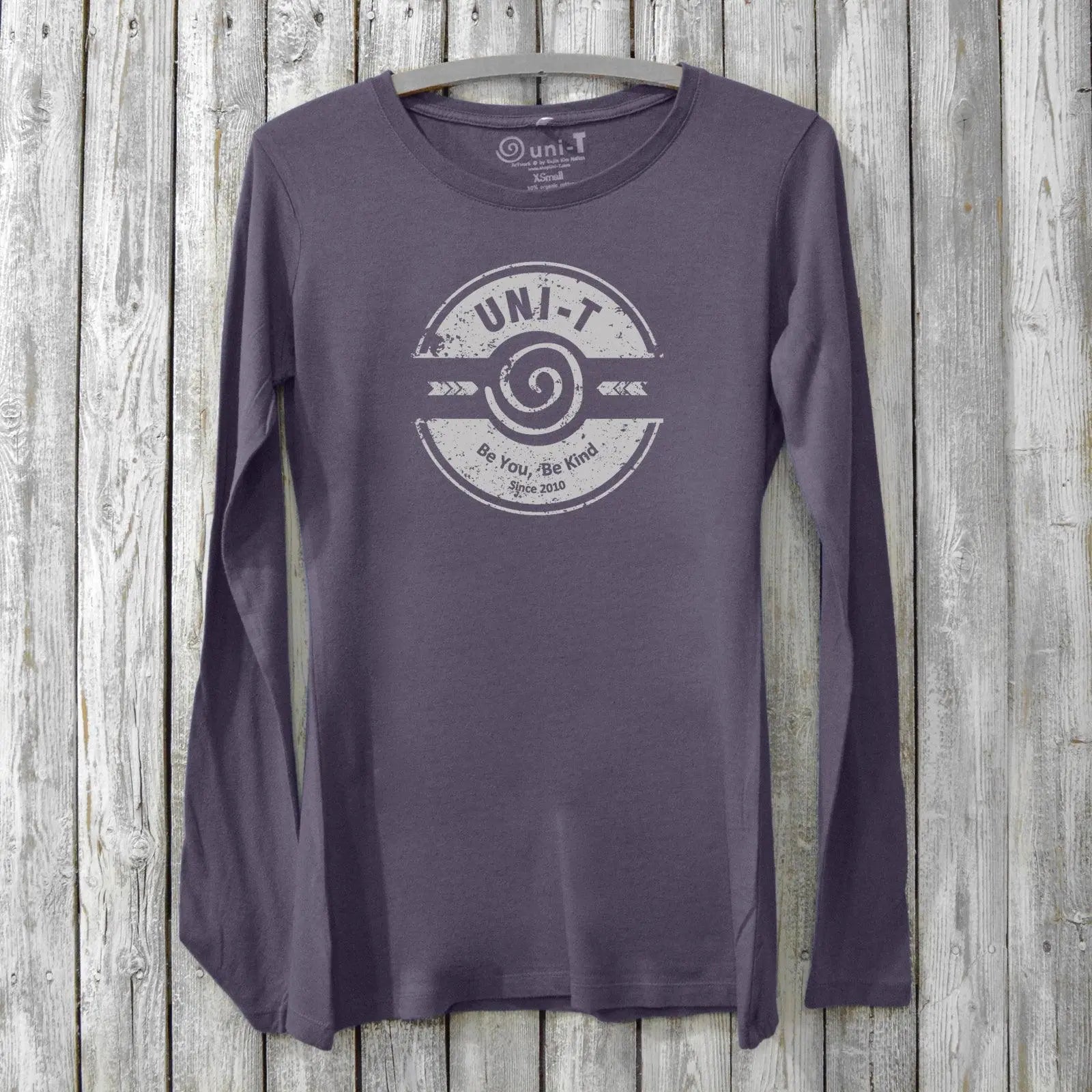 Purple eco-friendly women's long sleeve tee with 'Be You, Be Kind' design. Made from bamboo and organic cotton by Uni-T for mindful fashion lovers.