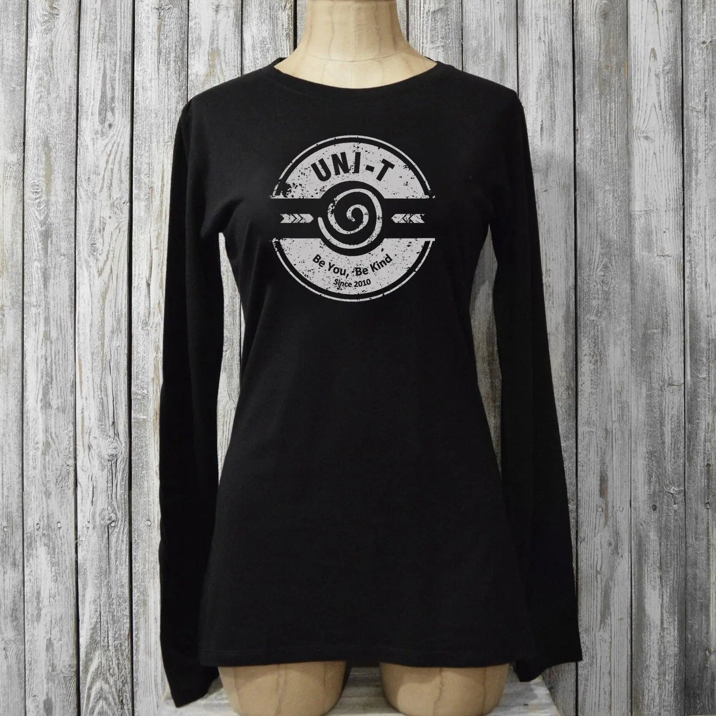 Black 'Be You, Be Kind' long sleeve T-shirt for women shown on mannequin. Bamboo and organic cotton blend by Uni-T, ideal inspirational gift.