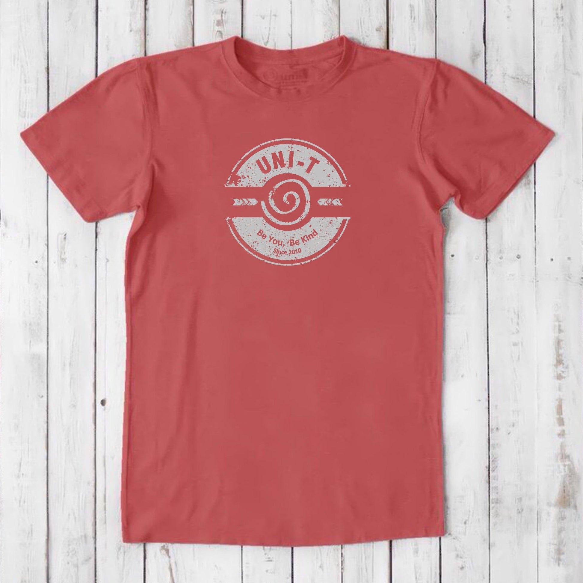 Coral red men's bamboo & organic cotton t-shirt with white 'Be You Be Kind' graphic by Uni-T, soft eco-conscious inspirational clothing.