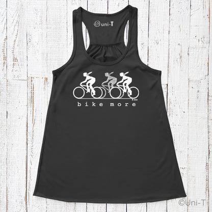 Black racerback flowy tank top for women with white 'bike more' cycling graphic, promoting sustainable living and active fashion.