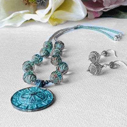 Celestial Necklace - Sun Moon Pendant Set shown with matching earrings, highlighting the intricate beadwork and cosmic pendant design.