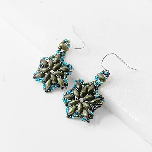 Blue and green medallion earrings featuring amethyst-toned beads and intricate floral design. Handcrafted sterling silver ear wires.