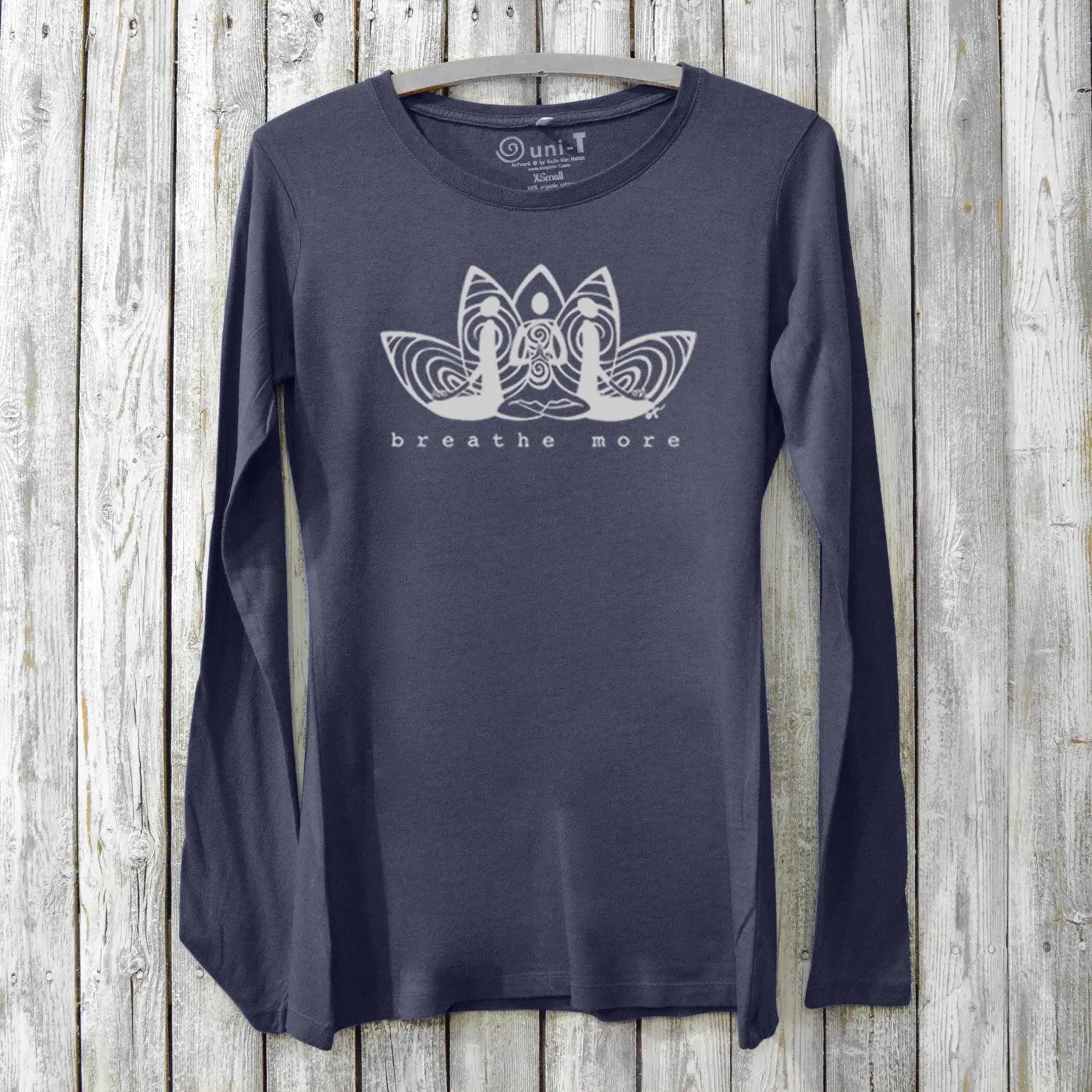 Women's meditation long sleeve T-shirt in navy bamboo and organic cotton with 'Breathe More' lotus graphic. Ideal for yoga and mindfulness wear.