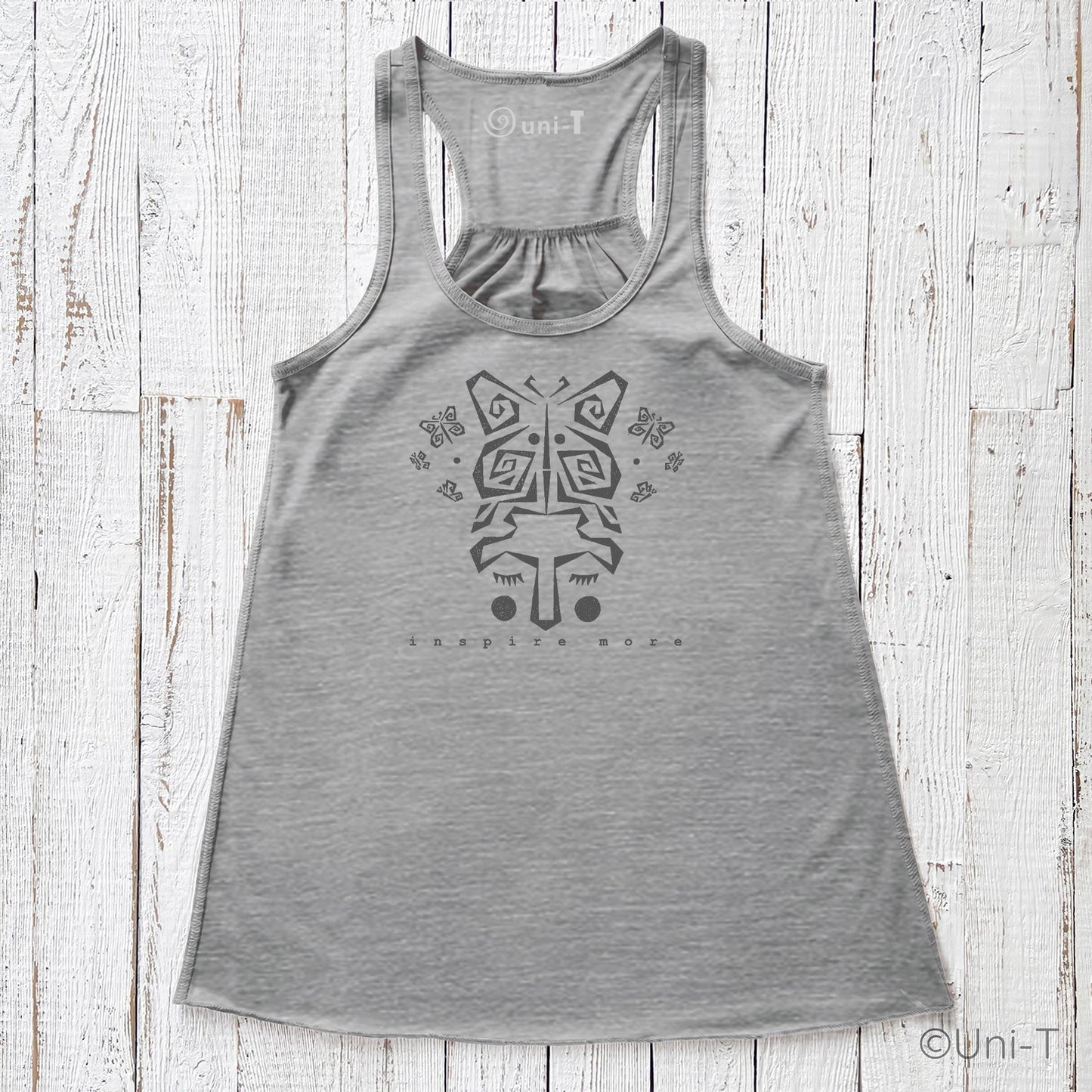 "Inspire More" Tank Top in heather gray with butterfly face design, eco-friendly and USA-made. Flowy racerback style ideal for personal growth wear.