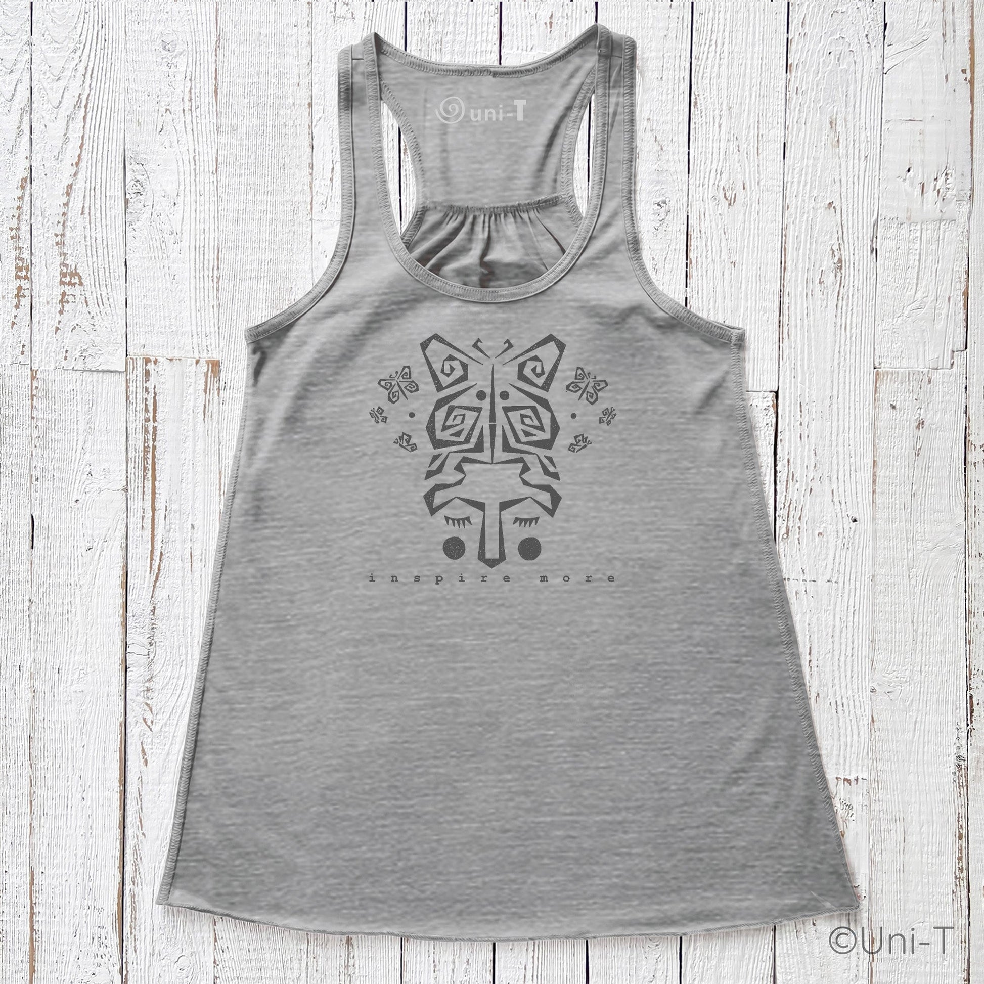 "Inspire More" Tank Top in heather gray with butterfly face design, eco-friendly and USA-made. Flowy racerback style ideal for personal growth wear.