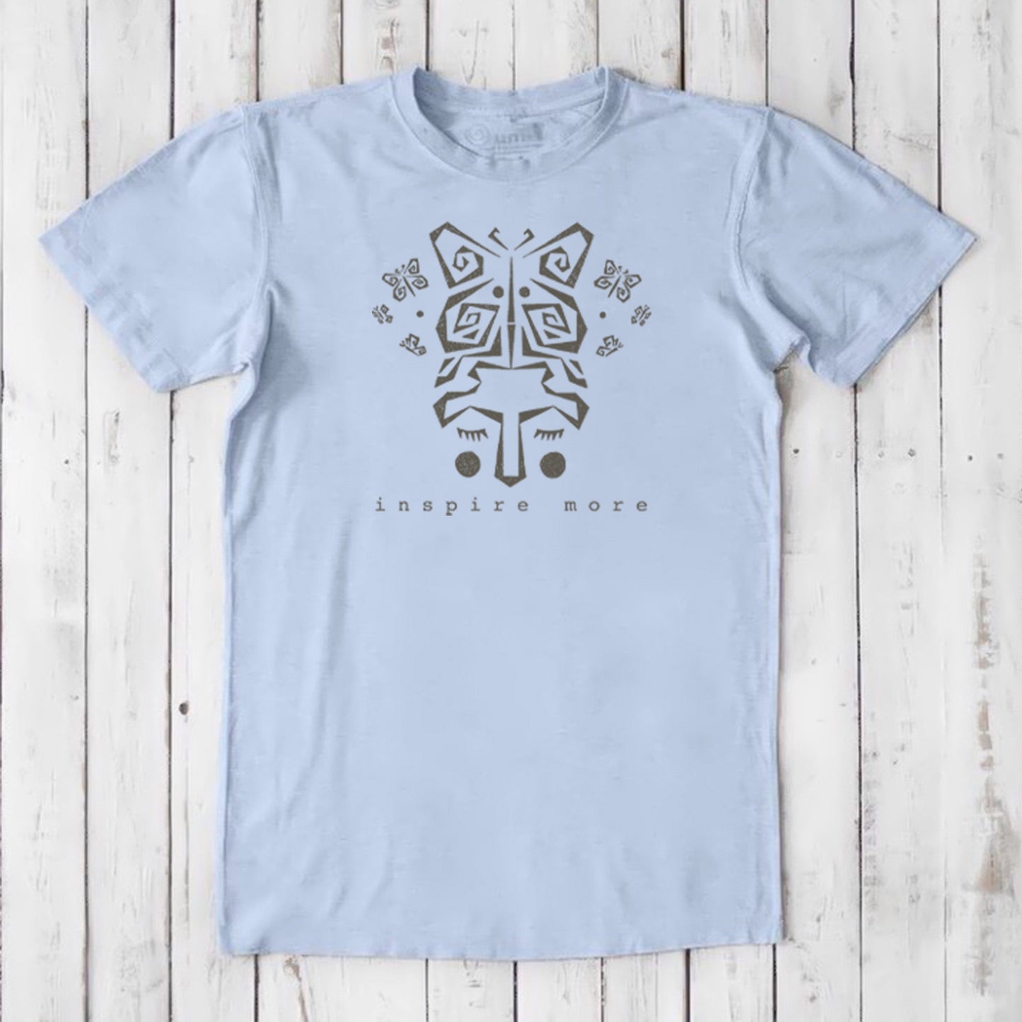 Light blue men's bamboo & organic cotton graphic tee with butterfly and hands design. 'Inspire More' message promotes transformation and mindfulness.