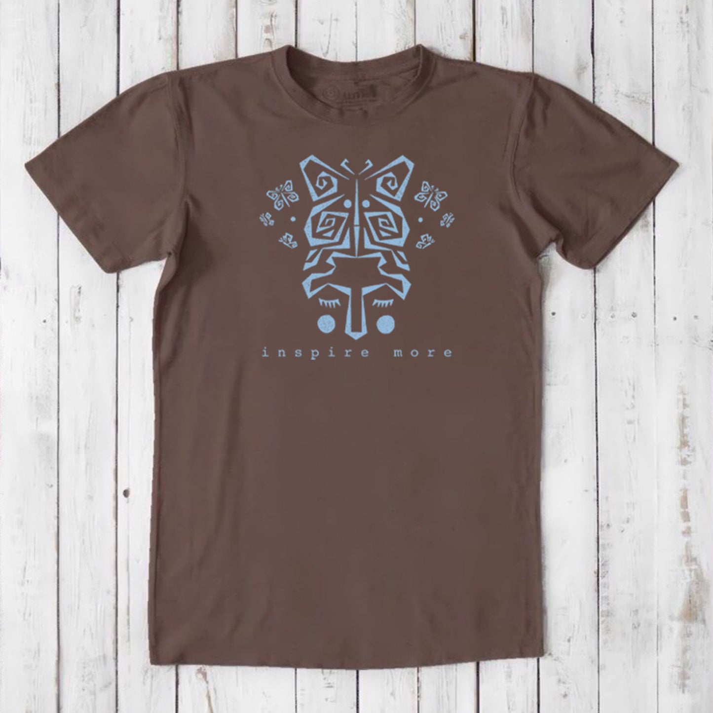 Brown men's graphic tee made from bamboo and organic cotton. Features light blue butterfly art and 'Inspire More' message for mindful living.