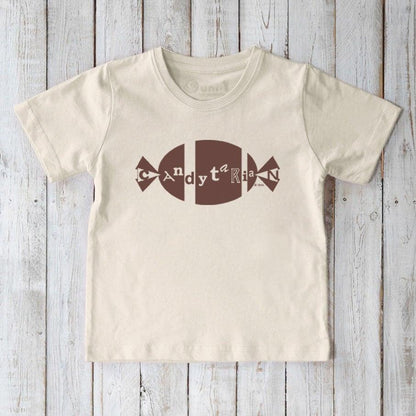 Cream Kids' Organic Cotton T-Shirt featuring brown candy graphic and playful 'Candytarian' text, sustainable humorous top for children.