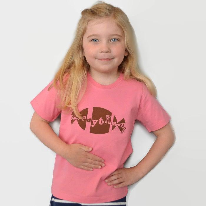 Child wearing pink 'Candytarian' Organic Cotton T-Shirt with brown candy graphic, sustainable and funny kids' graphic tee by Uni-T.