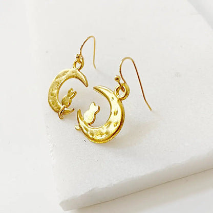 Golden Kitty and Moon Earrings with detailed crescent moon and cat silhouette. Elegant gold plated charms for cat-themed jewelry fans.
