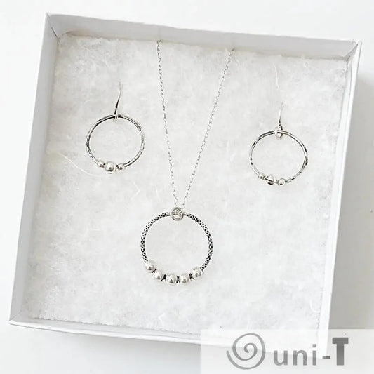 Circle Fidget Earrings & Necklace - Circle Fidget Jewelry Set displayed in a gift box with textured white padding, ideal for gifting.