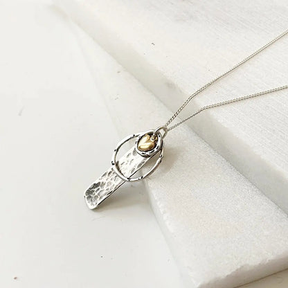 Elegant Circle Tag Necklace - Silver Circle Gold Heart | Sterling with hammered tag pendant and gold heart charm. Perfect for gifting or layering.